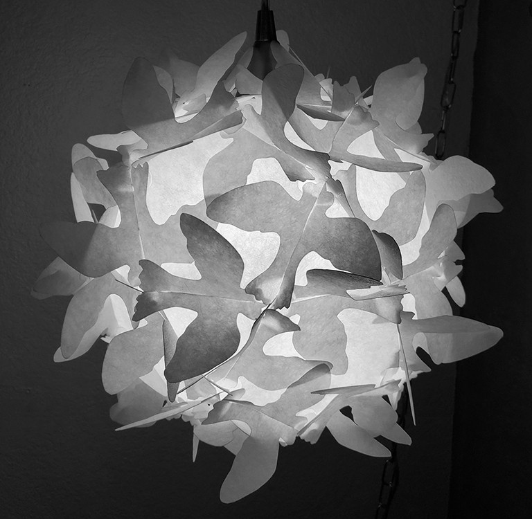 Here is an example of a lamp that utilizes mirror-image extensions to achieve the butterfly effect... in this case, actually birds. butterfly-problem
