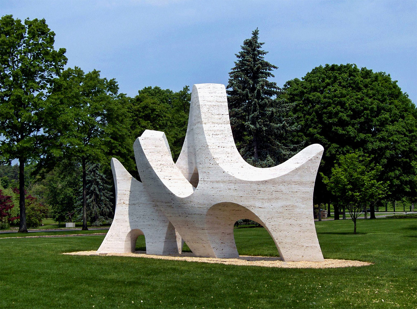 PASSAGE by Richard Erdman, 1985. Travertine, located at Donald M. Kendall Sculpture Gardens at PepsiCo, Purchase, NY. Photo credit, unknown. Richard-Erdman-sculpture-stone-passage-4